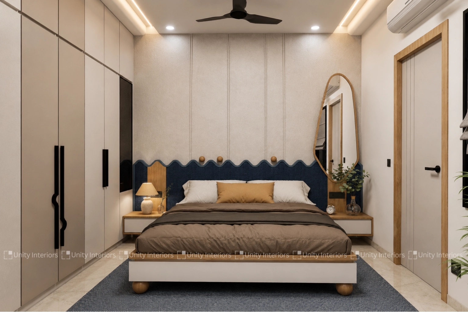 Bedroom design with wave-pattern headboard and arched mirror by Unity Interiors Ahmedabad